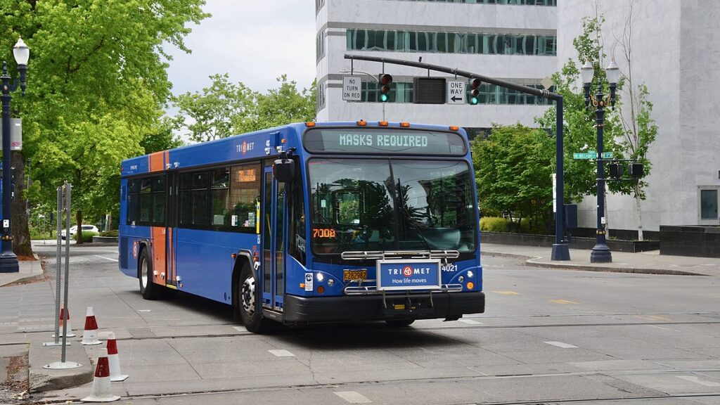TriMet bus with Masks Required notice on its destination sign during pandemic May 2021 e1650468466138